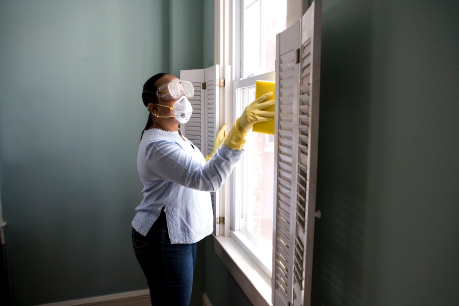 Elevation Pro technician wiping and cleaning a surface with professional care